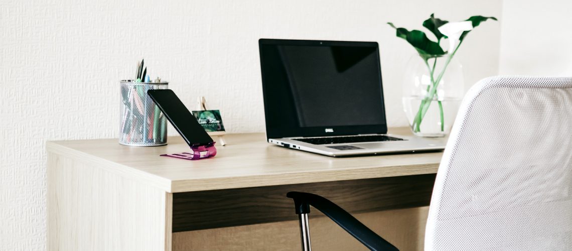 Canva - Laptop Computer on Brown Wooden Desk