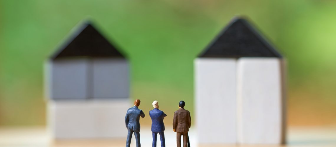 bigstock-Miniature-Businessmen-Standing-238390264 e